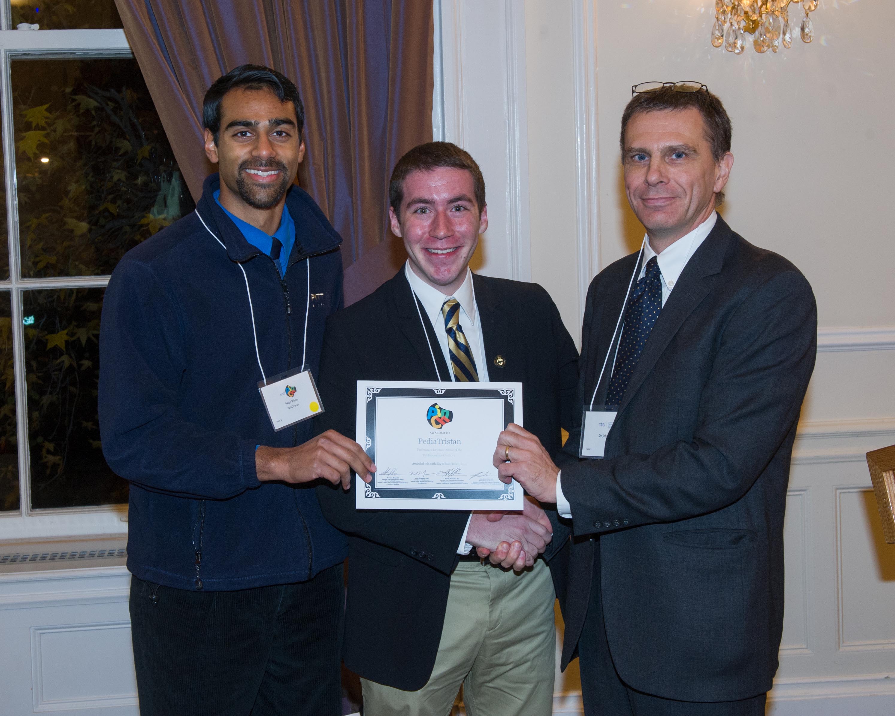 PediaTristan team holding award