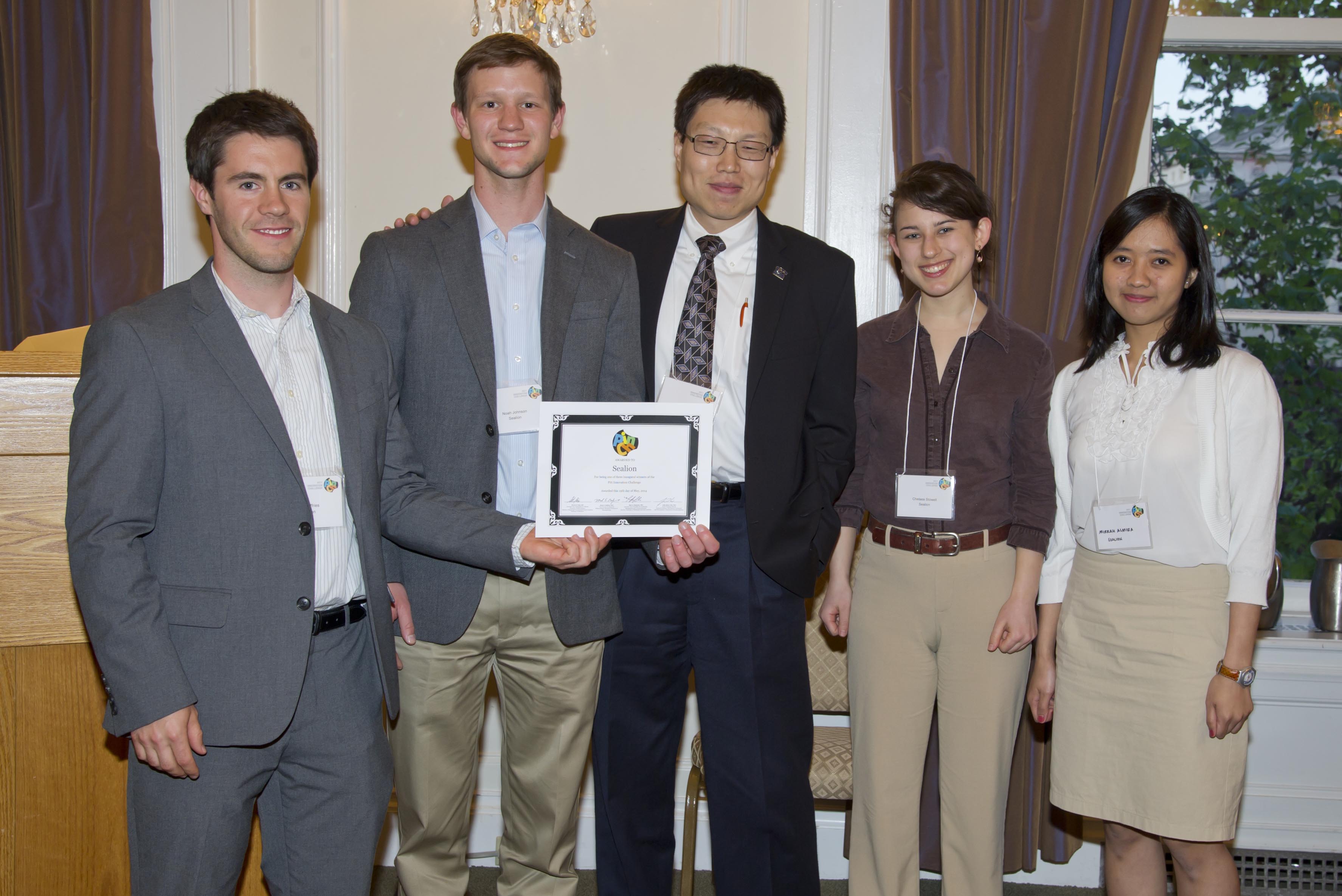 Sealion team holding award