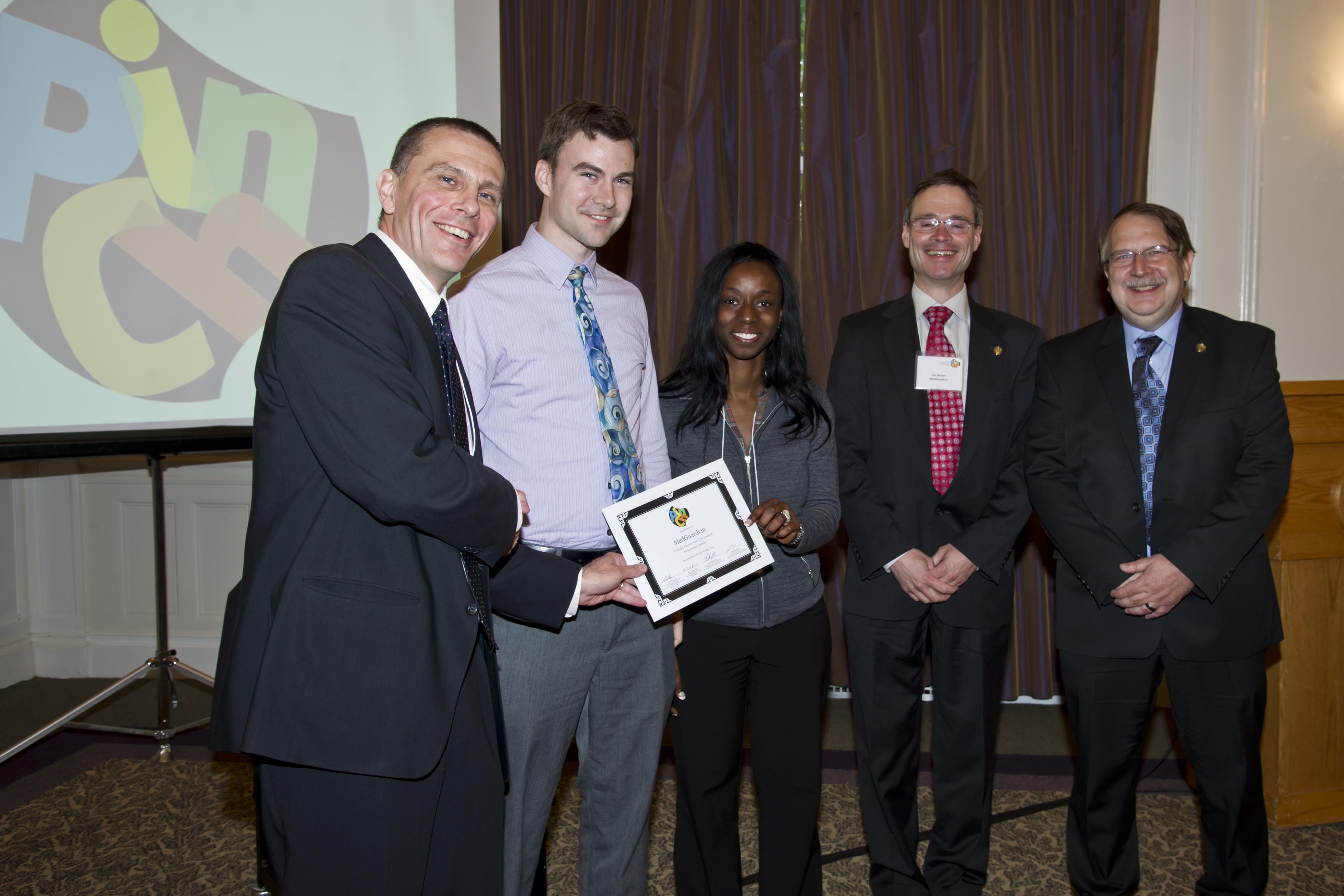 MedGuardian team holding award